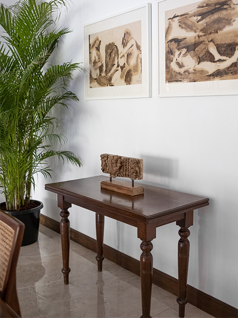 Hanging wall art with a side table - Beautiful Homes